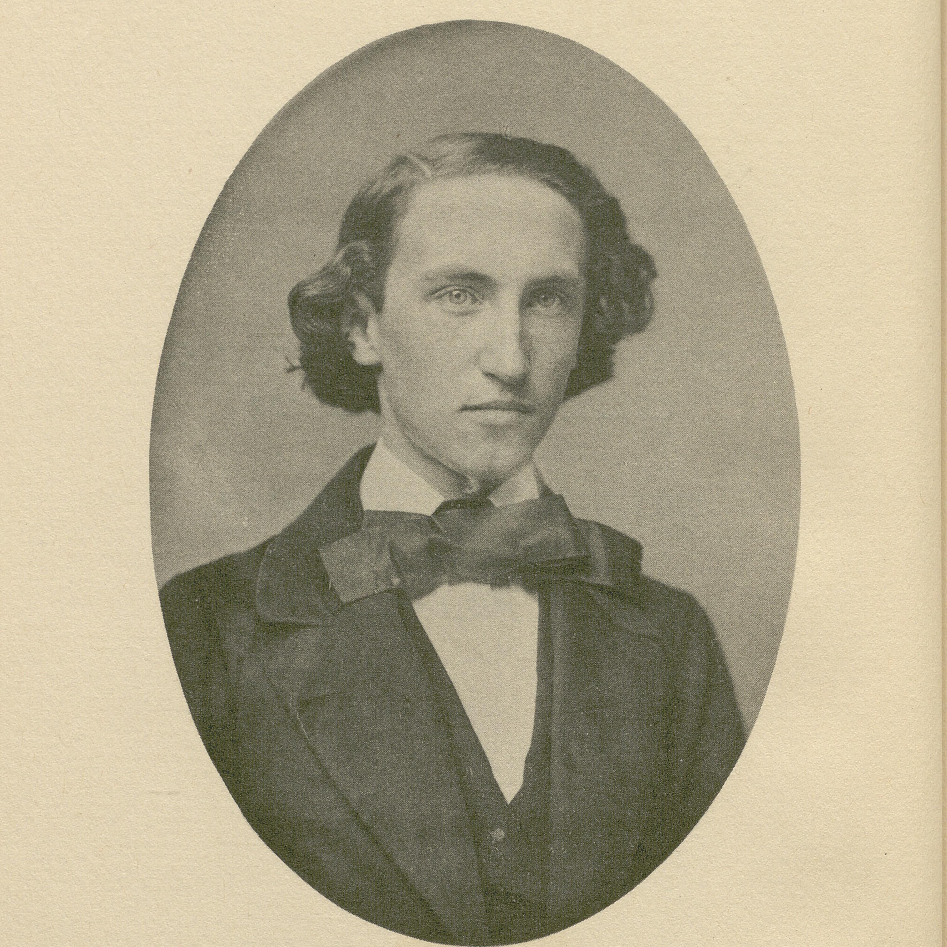 Daguerreotype of a young man. He has longer hair and wears a bowtie and formal suit.